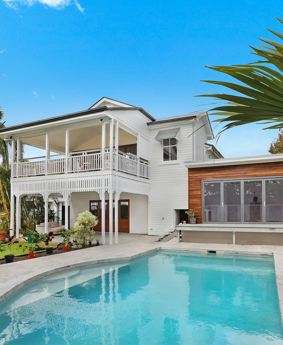 Modern home exterior with pool and patio