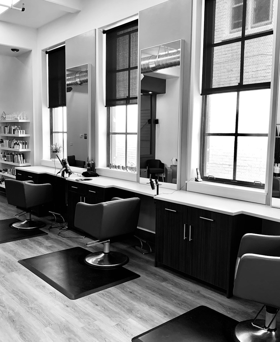 Modern salon with styling stations and chairs