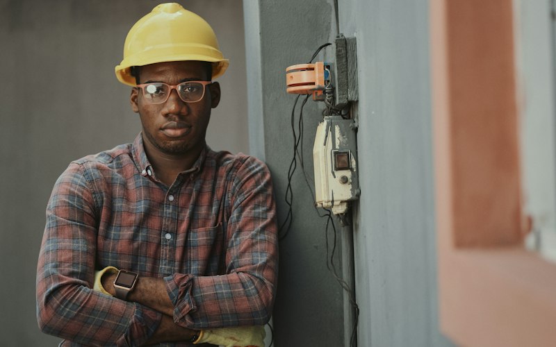 Trades technician in a hard hat ready for a service call