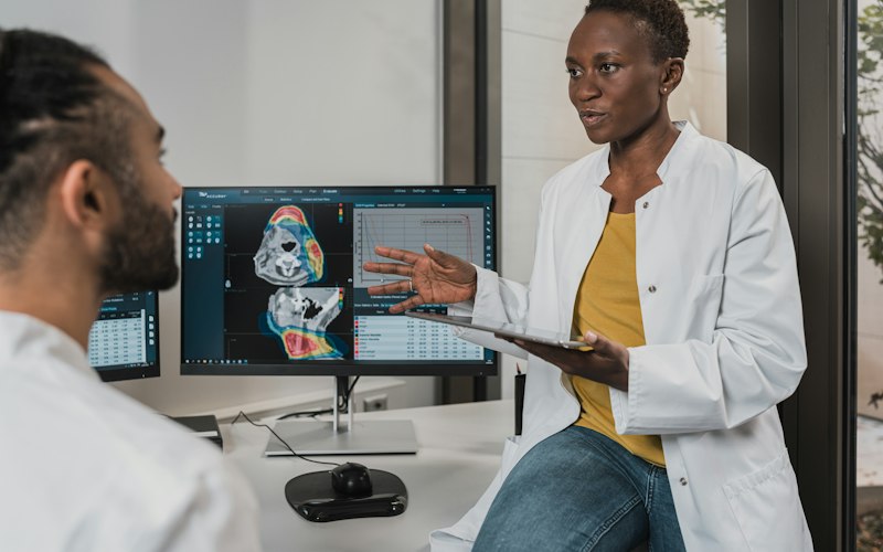 Doctor explaining medical imaging results in a clinic