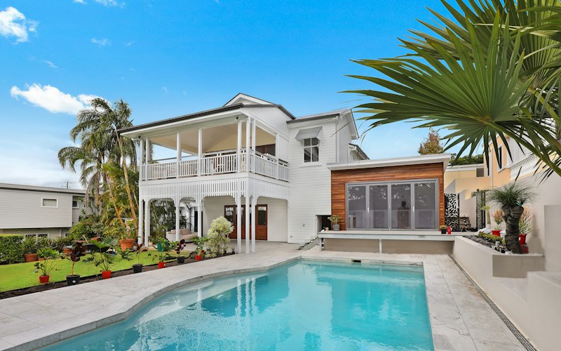 Modern home exterior with pool and patio